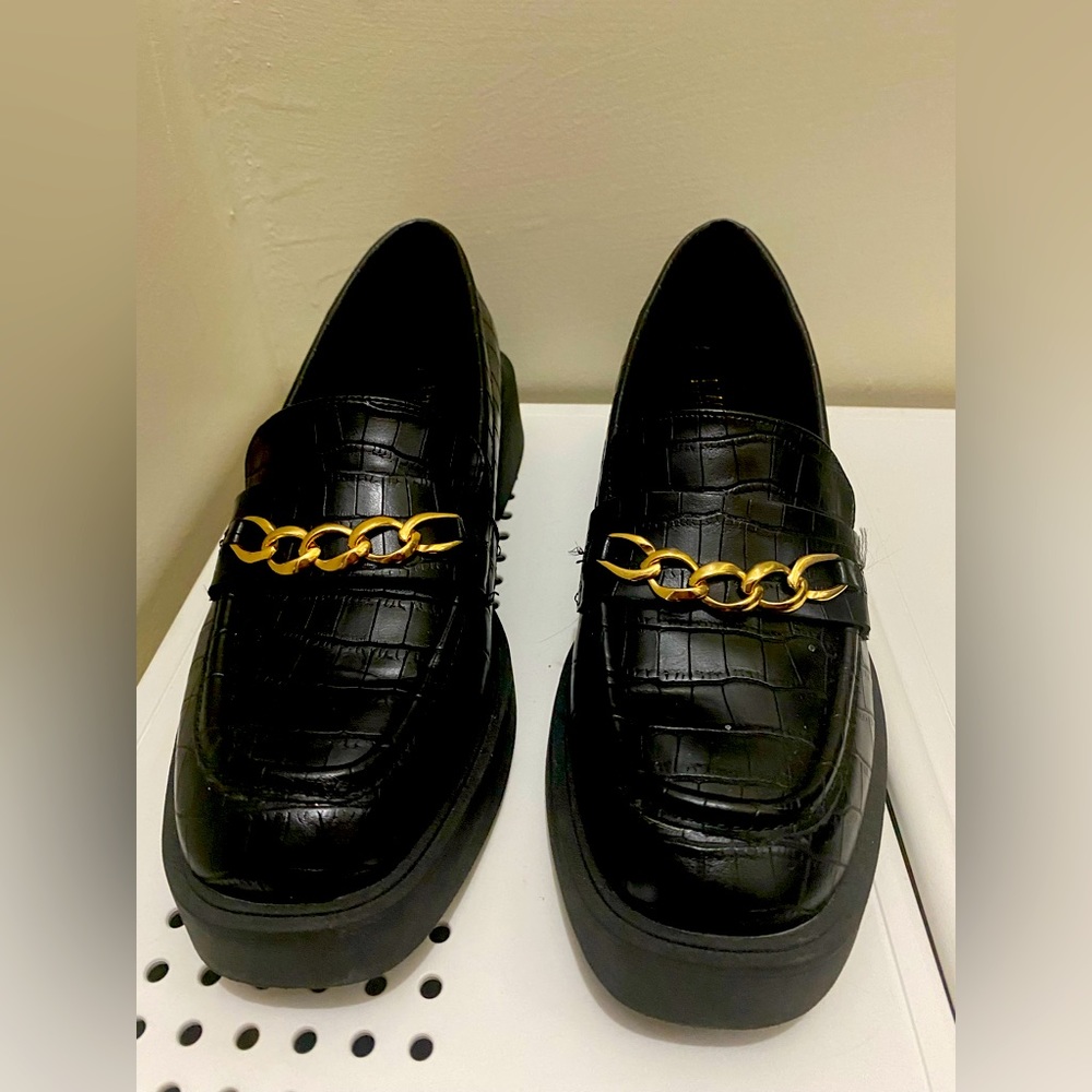 Black platform loafers